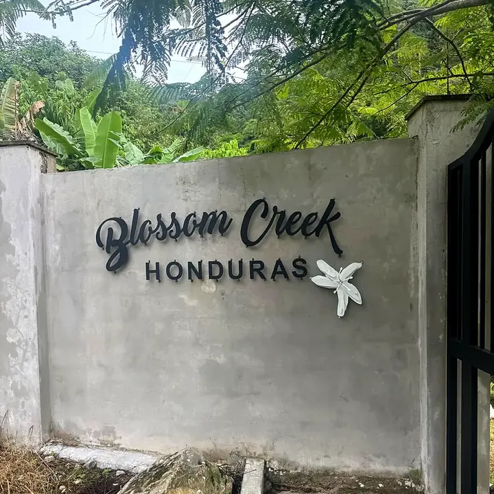The Blossom Creek sign at the entrance to the co-operative in Honduras